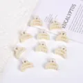 Set of elegant cream-colored small hair claw clips featuring faux pearl embellishments - Hollow Crescent Style / 10 Pieces/Pack