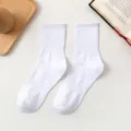 Classic solid white crew socks for men and women, comfortable ribbed athletic cotton socks. - One Size / Crew Socks / White