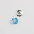 Close-up of cute enamel daisy flower charms, silver alloy DIY jewelry making pendants. - Blue