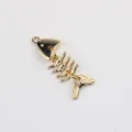 Gold alloy fish bone pendant DIY jewelry accessory detail view for handmade necklaces. - Gold