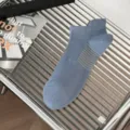 Men's breathable mesh ankle socks in light blue with pull tab, comfortable everyday casual wear. - One Size / Blue