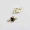 Close-up detail of the metal heart arrow pendant DIY jewelry accessory charms parts. - Gold Base Black