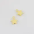 Detail view of yellow alloy five-pointed star charm pendant for DIY jewelry accessories. - Yellow