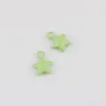 Close-up detail view of light green alloy painted star pendant charm for DIY jewelry. - Fruit Green