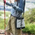 Outdoor drawstring crossbody bag hiking shoulder bag portable storage bag detail view - Beige
