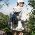 Outdoor hiking crossbody bag with water bottle holder, lightweight black drawstring chest bag. - Black