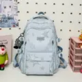 Zaino scolastico casual con stampa di stelle e tasche multiple per viaggi e lavoro - Con Ciondolo / Blu