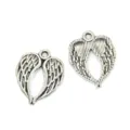 Antique silver wing charms close-up, perfect for DIY jewelry making, bracelets and necklaces. - Wing Charm (A2-308) / 22*17mm (1.26g) / Antique Silver