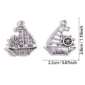 Colgantes de metal plateado con diseño de barco de vela y timone para joyería artesanal DIY. - Estilo Vela Timón (A9-202) / 28*22mm (2.83g) / Plata antigua