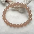 Exquisite pink quartz gemstone bracelet detail, smooth round beads shining gracefully. - 8mm / Lotus root pink
