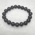 Quartzite jade round bead bracelet detail view showing smooth dark purple texture and polish. - 10mm / Smoke Purple