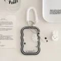 Close-up of transparent wavy card holder detail with white spring strap and cute ghost pendant - Black