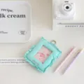 Detailed view of the cute quilted fabric card holder with clear window and metal ring pendant. - Lake Green