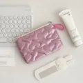 Close-up detail of pink quilted heart makeup pouch with smooth fabric and zipper closure. - Heart-LOVE Pink