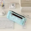 Light blue multi-layer pencil case with ruffles, star pendant, and spacious storage. - Blue