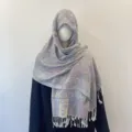 Detailed view of an ethnic paisley jacquard shawl scarf featuring decorative white tassels - 70x180cm / Lavender