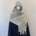 Detailed view of ethnic paisley jacquard pattern on a beige tassel shawl - 70x180cm / Light Taupe Grey