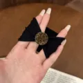 Black fabric hair tie with leopard print round button detail, stylish ponytail holder accessory for women - Round Ball Style / Black