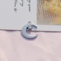 Close-up detail shot of a silver moon and star metal pendant charm, ideal for DIY jewelry. - Moon and Star Style(2)