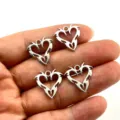 Silver alloy hollow heart pendant DIY jewelry accessory, detailed close-up shot for crafting. - Wing Hollow Heart Pendant (HJ25-1116-6) / 20mmx19.5mm / Antique Silver