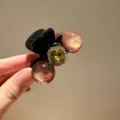 Small rhinestone hair claw clip with pink beads and central yellow crystal detail for women. - Brown
