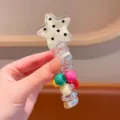 Close-up of a cute star telephone wire hair tie with colorful beads, ideal for cute ponytails. - Beige Star Spiral Hair Tie