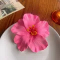 Pink hibiscus flower hair clip, Hawaiian style accessory, ideal for summer beach wear. - Pink