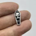 Close-up detail of the vintage Halloween coffin skull nail art charm showing compact metal size. - Coffin Skull