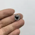 Close-up detail of vintage black heart metal nail art charm, gothic DIY accessory design. - Hollow Heart