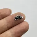 Detailed close-up view of a black enamel devil heart nail art charm, perfect for DIY crafts. - Devil Angel Heart