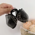 Pinza de pelo con lazo de malla y diamantes negros, elegante accesorio brillante para mujeres. - Clip de Malla de Mariposa Negra