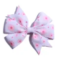 Detailed macro view of white grosgrain ribbon hair bow with pink daisy floral prints - No Accessories on Back / White