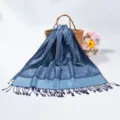 Close-up detail of blue paisley jacquard pashmina scarf with elegant tassel fringe trim - Deep Blue (TH03)