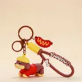 Porte-clés teckel mignon avec pendentif saucisse, joli bijou de sac et cadeau créatif idéal. - Rouge