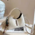 Beige leather dumpling hobo shoulder bag with metal lock and chic charm for women style. - White (With Heart Pendant)