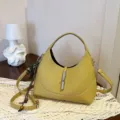 Yellow leather hobo shoulder bag for women, stylish dumpling handbag with metal lock and strap. - Grass Green With Pendant