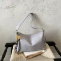 Grey slouchy shoulder bag for women, stylish casual crossbody handbag with floral bag charm. - With Charm / Gray