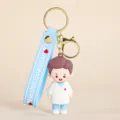 Süßer Arzt Cartoon PVC Schlüsselanhänger mit blauem Band und goldenem Ring, ideal. - Männlicher Arzt