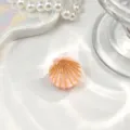 Macro view of a mini pink shell hair claw clip with elegant gold line textured details. - Shell Decoration / Mini Size (Approx 2.5cm) / Orange