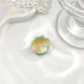 Close-up view of a mini mint green shell-shaped hair claw clip with gold glitter accents - Shell Decoration / Mini Size (Approx 2.5cm) / Green