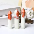 Set of three hexagonal single point crystal towers with orange and white stone patterns. - Orange Flame Agate Pillar / 7-8cm