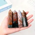 Hand holding four polished natural ocean jasper hexagonal crystal towers for healing - 9-10cm / Ocean Jasper Pillar / Ocean Jasper Color
