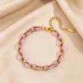 Stainless steel Cuban chain bracelet with purple enamel detail, close-up showing polished metal finish. - Purple Enamel Bracelet