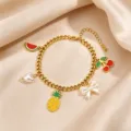 Gold plated stainless steel charm bracelet featuring cute fruit and bow pendants. - Pineapple Pendant Style / Gold