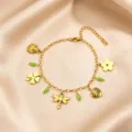 Stainless steel 18K gold plated charm bracelet featuring cute nature pendants and green beads. - Dragonfly Pendant Style / Gold