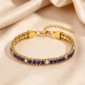 Gold titanium steel bracelet featuring alternating blue and white cubic zirconia stones. - Dark Blue and White Rhinestone Claw Chain / Gold