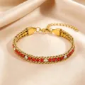 Elegant women's titanium steel bracelet featuring sparkling red and white zirconia stones for daily wear. - Red Woven Rhinestone Bracelet / Gold