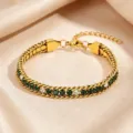 Titanium steel women's bracelet featuring green and white zirconia stones, elegant and durable. - Green and White Rhinestone Claw Chain / Gold