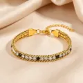 Gold titanium steel tennis bracelet with sparkling clear and black cubic zirconia stones. - White and Black Rhinestone Claw Chain / Gold