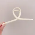 Minimalist matte white metal hair claw with a unique cross loop design for chic daily styling - Cross Geometric (Approx 14cm) / Matte Cream